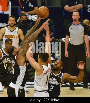 Los Angeles, United States. 02nd May, 2021. Los Angeles Clippers' center DeMarcus Cousins (15) blocks the shot of Denver Nuggets' forward Michael Porter Jr. during the second half at Staples Center in Los Angeles on Saturday, May 1, 2021. The Nuggets defeated the Clippers 110-104. Photo by Jim Ruymen/UPI Credit: UPI/Alamy Live News Stock Photo