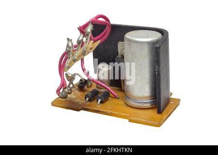 radio components mounted on old textolite board. part of power supply of Vintage tube amplifier. Part of voltage converter scheme, removed from device Stock Photo