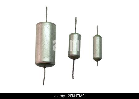 electronic elements of circuit of  tube sound-amplifying equipment set of vintage metal-paper capacitors with green ends, items of various capacities. Stock Photo