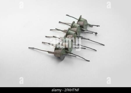 row of medium power rectifier diodes. Vintage electronic components with long leads for mounting and combination Stock Photo