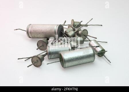 bunch of electronic components from retro audio equipment. Rectifier diodes and metal-paper capacitors with long leads Stock Photo