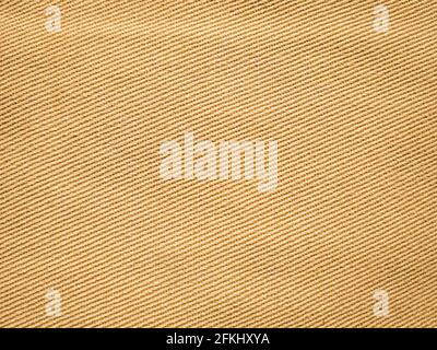 old khadi cloth texture background. light natural linen texture for the background. Golden yellow linen fabric of table cloth texture background. Stock Photo