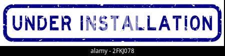 Grunge blue under installation word square rubber seal stamp on white background Stock Vector