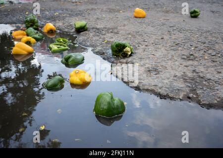 Phnom Penh, Cambodia. 24th Apr, 2021. Vegetables are seen on the street outside Deum Kor market that was ordered to be shutdown.Phnom Penh remains in lockdown as Cambodia takes drastic measures to reduce the spread of its worst COVID-19 outbreak to date. The lockdown has forced many out of work, including factory workers and market vendors, leaving the cities' poorest residents struggling or unable to afford basic necessities. (Photo by Andy Ball/SOPA Images/Sipa USA) Credit: Sipa USA/Alamy Live News Stock Photo