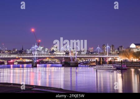 Illuminated River Thames Golden Jubilee Bridges Hungerford Bridge by Sir John Hawkshaw & Lifschutz Davidson Sandilands Leo Villareal Studio Stock Photo