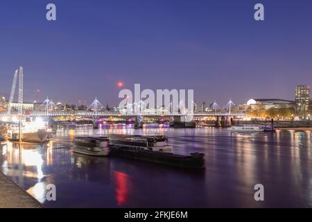 Illuminated River Thames Golden Jubilee Bridges Hungerford Bridge by Sir John Hawkshaw & Lifschutz Davidson Sandilands Leo Villareal Studio Stock Photo