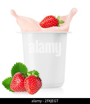 strawberry falling in plastic cup with yogurt Stock Photo