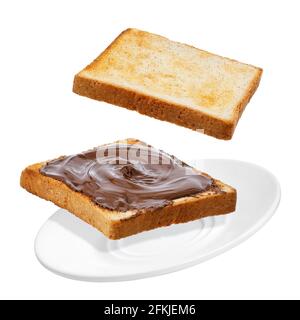 flying bread with chocolate cream isolated on white Stock Photo