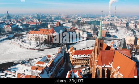 Wroclaw, Poland 02.15.2021 - Stary Rynek square and old market square in the city of Wroclaw, Poland. Smoke coming out of the chimneys from the power plant. High quality photo Stock Photo