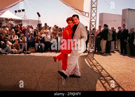 John Travolta and Emma Thompson at Cannes May 1998 for the film festival stars of film Primary Colors strutting their stuff at roof top photo call Stock Photo