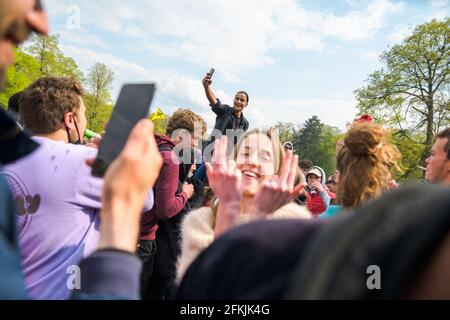 Belgium, Germany, May 1, 2021. People dance during Boum 2 event in Brussels, Belgium on May 1, 2021. The Collectif Abime called for a second edition of La Boum, an illegal gathering to protest against the Covid19 mesures and happening in Le Bois de la Cambre in Brussels. Photo by Julie Sebadelha/ABACAPRESS.COM