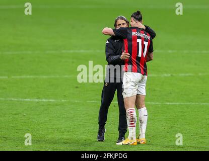 Milan, Italy. 01st May, 2021. Zlatan Ibrahimovic of AC Milan and Head Coach of Benevento Calcio, Filippo Inzaghi hugging during the 2020/21 Italian Serie A football match between AC Milan and Benevento Calcio at Stadio Giuseppe Meazza.Final score; AC Milan 2:0 Benevento Calcio. (Photo by Fabrizio Carabelli/SOPA Images/Sipa USA) Credit: Sipa USA/Alamy Live News Stock Photo