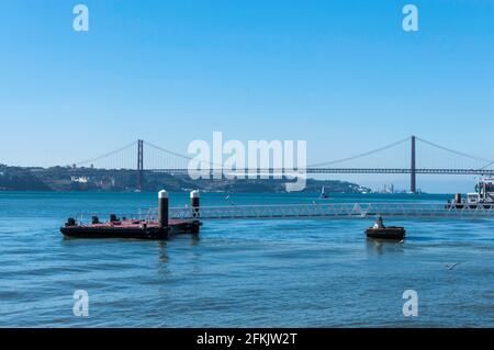 Lisbon, April 25th Bridge over the Tagus. In the foreground a floating platform Stock Photo