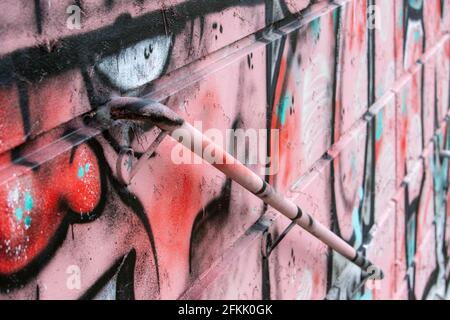 graffiti on a wall with a handrail Stock Photo