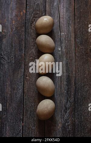 Natural dye for Easter eggs - beetroot on vintage wooden background Stock Photo