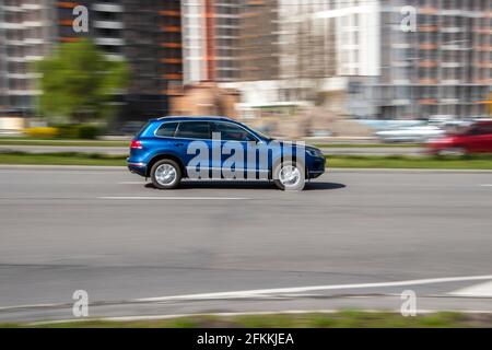 Ukraine, Kyiv - 26 April 2021: Blue   car moving on the street. Editorial Stock Photo