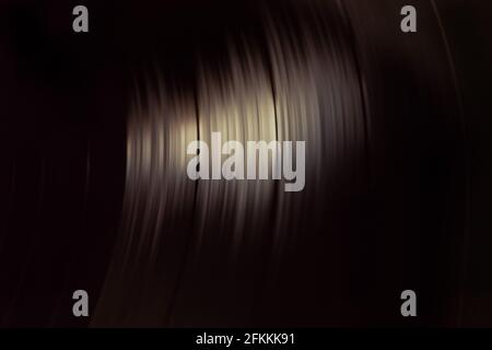 Close-up of a spinning vinyl record. Top view. Copy space. Concept of retro style, analogic technology Stock Photo