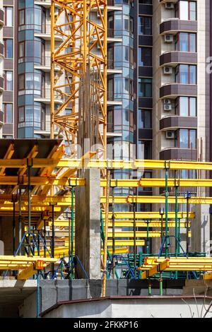 Construction of new buildings in a monolithic-frame way using a system with a system of metal scaffolding. Stock Photo