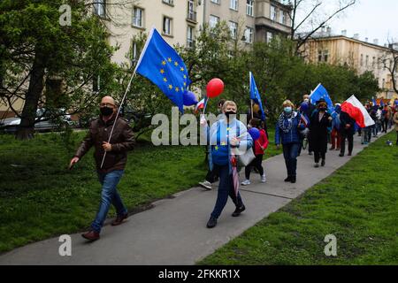 Cracow, Poland. 01st May, 2021. Supporters of the European Union, sceptical about the government's policy are seen holding EU flags during the march.Poland is a member of European Union since May 1st 2004. On the 17th anniversary of Poland's membership in the European Union both Polish and European Union flags have been seen displayed on buildings. Opponents of the government's policies marched through city streets with both Polish and EU flags. (Photo by Filip Radwanski/SOPA Images/Sipa USA) Credit: Sipa USA/Alamy Live News Stock Photo