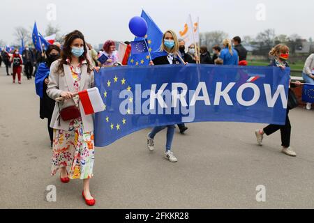 Cracow, Poland. 01st May, 2021. Supporters of the European Union, sceptical about the government's policy are seen with a banner saying Krakow, during the march.Poland is a member of European Union since May 1st 2004. On the 17th anniversary of Poland's membership in the European Union both Polish and European Union flags have been seen displayed on buildings. Opponents of the government's policies marched through city streets with both Polish and EU flags. (Photo by Filip Radwanski/SOPA Images/Sipa USA) Credit: Sipa USA/Alamy Live News Stock Photo