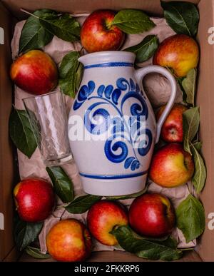 bembel with a glass and apples gift box concept Stock Photo
