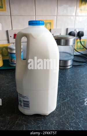 Milk can on kitchen top Stock Photo