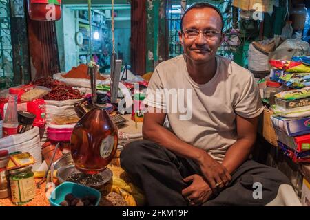 KHULNA, BANGLADESH - NOVEMBER 12, 2016: Local seller at a market in Khulna, Bangladesh Stock Photo