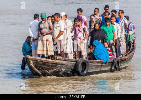 KHULNA, BANGLADESH - NOVEMBER 16, 2016: People on a ferry on Rupsa river in Khulna, Bangladesh Stock Photo