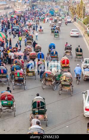 DHAKA, BANGLADESH - NOVEMBER 22, 2016: Traffic consisting mostly of cyclo risckshaws on Mirpur Road in Dhaka, Bangladesh Stock Photo