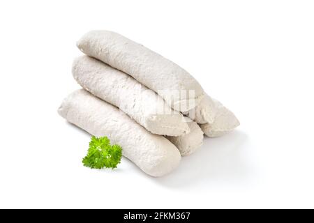 Raw Bavarian sausages, so-called Wollwurst, a specialty similar to the German veal sausage but without casing, lying on a white background Stock Photo