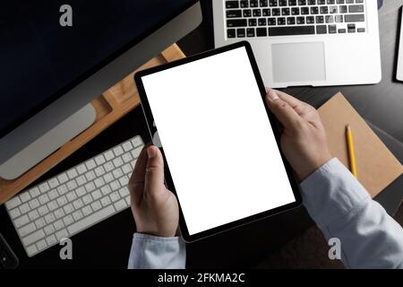 hands holding digital Mock up tablet touch screen device isolated screen and tablet pc with blank white screen Stock Photo