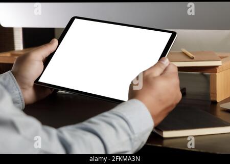 hands holding digital Mock up tablet touch screen device isolated screen and tablet pc with blank white screen Stock Photo