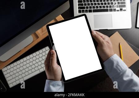 hands holding digital Mock up tablet touch screen device isolated screen and tablet pc with blank white screen Stock Photo