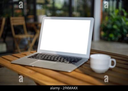 laptop computer on desk Laptop with blank screen on table in cafe  notebook Home interior or office background Stock Photo