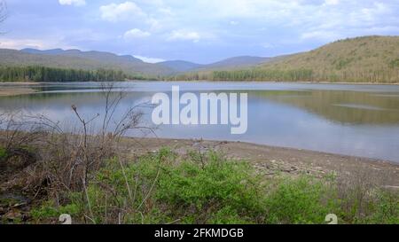 Half empty drinking water reservoir, Cooper Lake, Lake Hill, NY, USA Stock Photo