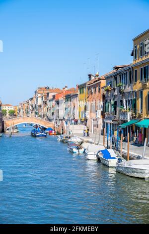 Boats on a canal, colorful houses in Venice, Veneto, Italy Stock Photo