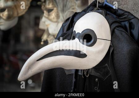 Venetian carnival mask, plague doctor, in a shop window, Venice, Veneto, Italy Stock Photo