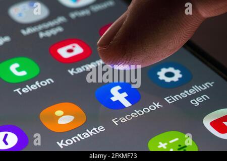 Facebook, contacts, phone, settings, logo, app icon, display on a mobile screen, smartphone Stock Photo