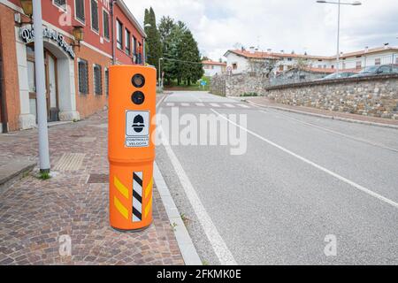 Speed camera installed on the roadside to monitor the speed of conductors Stock Photo