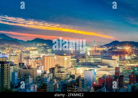 Nagasaki skyline cityscape of Nagasaki harbour harbor after sunset. Nagasaki City, Japan. Stock Photo