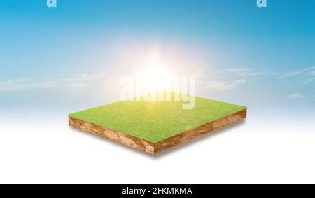 Soil cubic cross section with green grass field over blue sky background. Stock Photo
