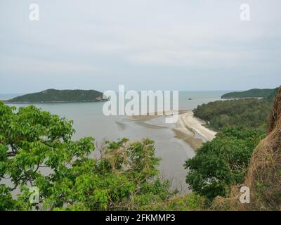 Aerial view of beach and sea at Laem Sala Beach , The white wave bubbles in the green water splash the brown sand, Khao Sam Roi Yot National Park Stock Photo