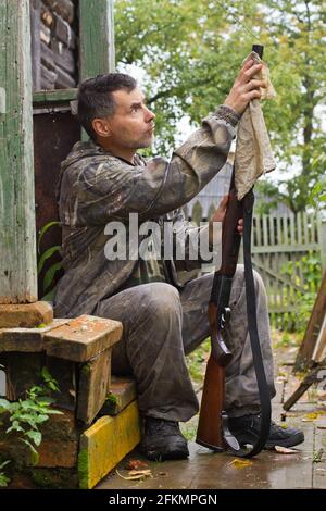 Barrel of a gun. Hunter with shotgun gun on hunt. Closed and open ...