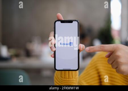 CHIANG MAI, THAILAND: MAY 03, 2021 : LinkedIn logo on phone screen. LinkedIn is a social network for search and establishment of business contacts. It Stock Photo