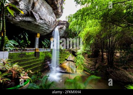 Motion blurred water  in  the temple under waterfall Wat Tham Heo Sin Chai waterfall. Kaeng Tana National Park, Ubonratchathani, Thailand Stock Photo