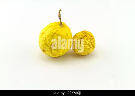 Close up dry yellow of Passionfruit (Passiflora edulis) on white background Stock Photo