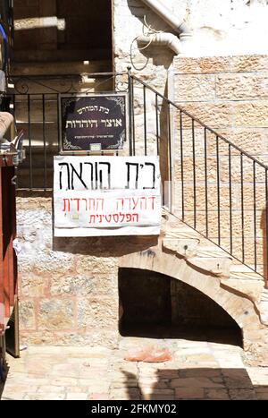 Anti Zionist ( Israeli ) slogans and stickers decorate the ultra Orthodox section of Toldos Aharon in Mea She'arim neighborhood in Jerusalem, Israel. Stock Photo