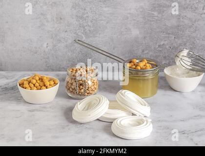 Vegan cooking concept. Meringue from canned chickpea water aquafaba. Healthy product. Eggs replacement and substitute.  Stock Photo