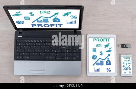 Profit concept shown on different information technology devices Stock Photo