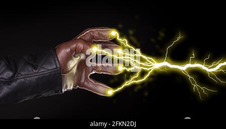 Hand shooting out a bolt of lightning - Dark and mysterious, isolated on black Stock Photo